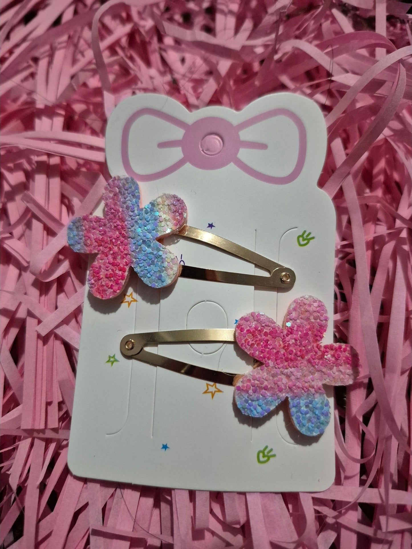 2 mixed coloured flower shapped glitter bendy clips £1