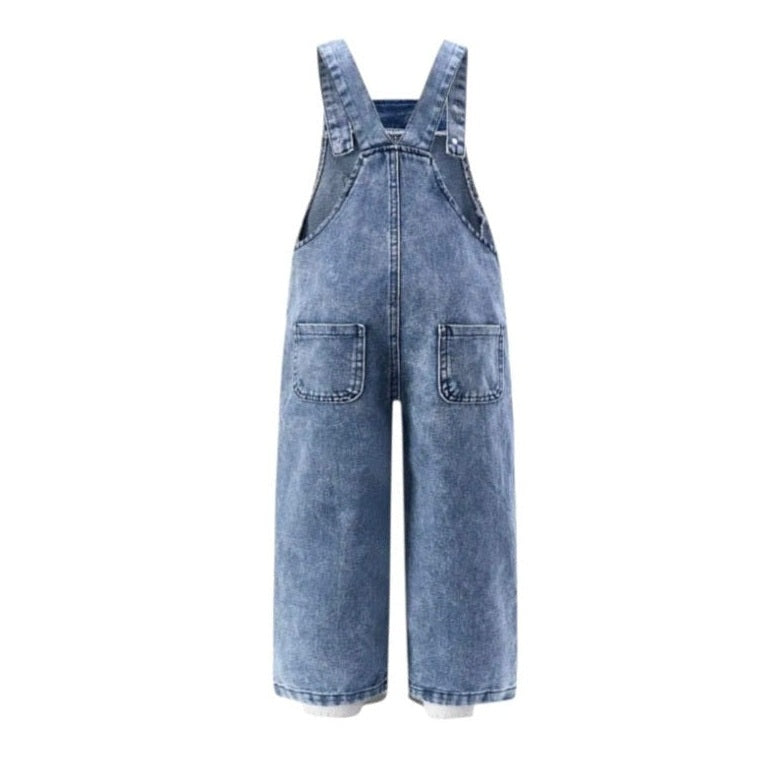 Blue denim overalls on a white background